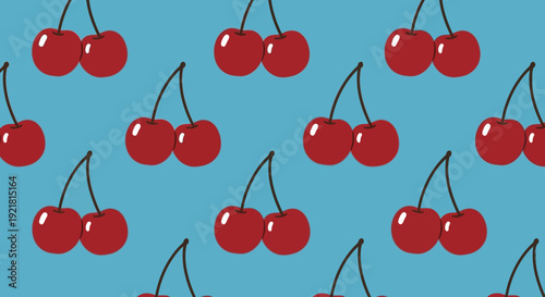 Vibrant cherries pattern on blue background for design and decoration