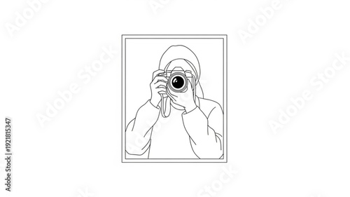 Person holding a vintage camera and taking a photo.