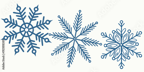 Three unique snowflakes showcasing the intricate beauty of winter's frozen artistry.
