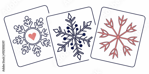 Three unique snowflake designs on playing cards with intricate patterns and colors