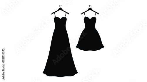 Two formal dresses hang on hangers a striking black silhouette