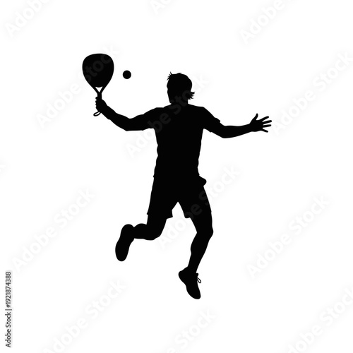 Silhouette of a man playing tennis, jumping and hitting the ball with a racket