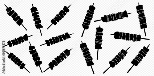 Set of black shish kebab skewer silhouettes scattered on a transparent background.