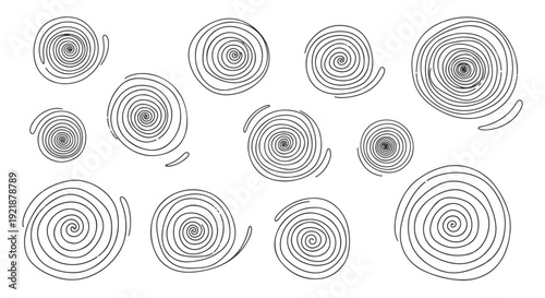 Abstract Spirals in Various Sizes and Shades of Gray and White on a Deep Black Background