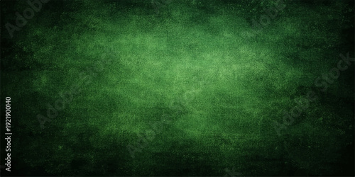 A dark vintage green grunge background with a textured aged paper pattern and blank copy space on a rough dirty wall surface for an old retro wallpaper design