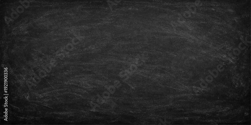 A blank vintage blackboard with a dark grunge texture and a rough grey surface provides an old paper-like material pattern for a textured wall backdrop design