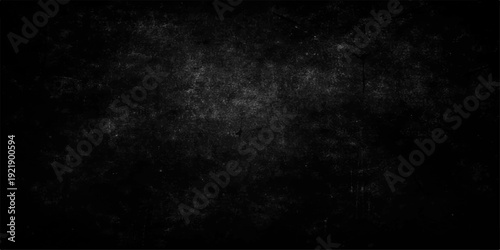 Dark grunge black and white stone wall texture with an empty rough concrete surface and vintage dirty paper pattern for a blank dark grey backdrop