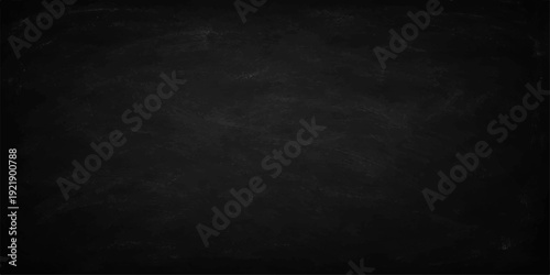 A blank old blackboard with a grunge texture and alpha channel set against a dark grey vintage stone wall backdrop for a textured chalkboard design
