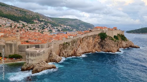 The historic Fort Lovrijenac on a rocky cliff and the blue Adriatic Sea in Dubrovnik, Croatia, on a sunny day.