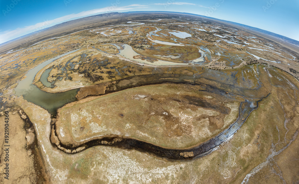 Obraz premium Aerial view over a wetland landscape with rivers and lakes on the pampas in the vicinity of the village of Gobernador Gregores, Santa Cruz Province Argentina