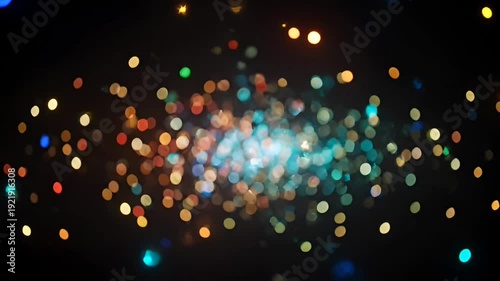 Abstract image of bokeh lights with a mix of colors in the dark
