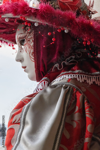 Elegant Venetian Masked Woman in Red and Silver Traditional Carnival Costume