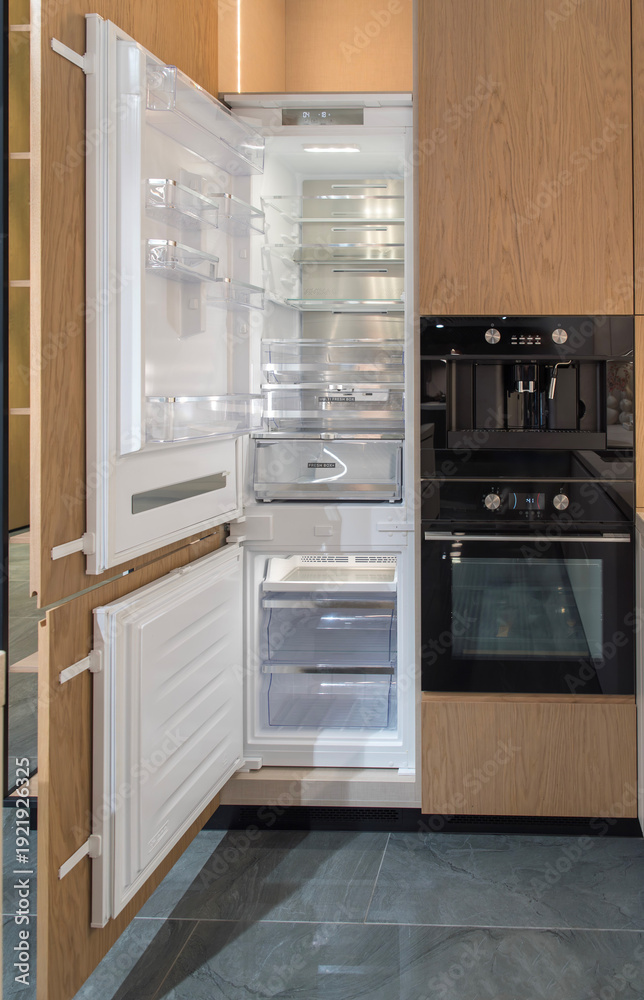 Fototapeta premium Built-in refrigerator with open door