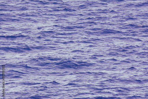 Blue ocean water surface texture with small waves natural sea background