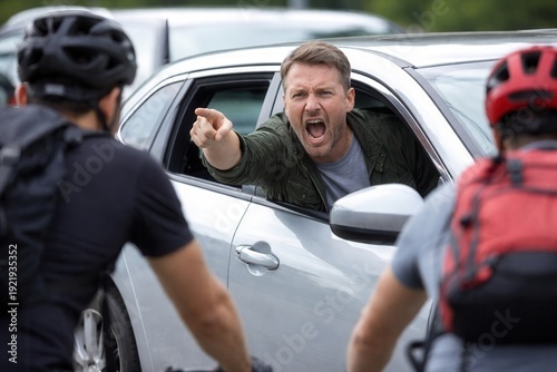 Driver yelling and pointing at cyclists on road