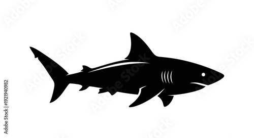 Black silhouette of a shark swimming.