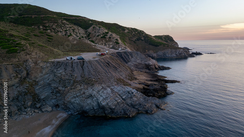 Fotografie Aerial view of Punta Argentiera cliffs and camper van parking, Sardinia
