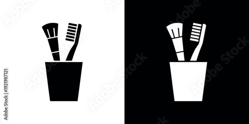 Two toothbrushes in a cup on black and white background