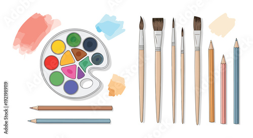 A flat lay arrangement showcasing a watercolor paint palette with brushes and colored pencils, alongside abstract paint strokes on a white background.