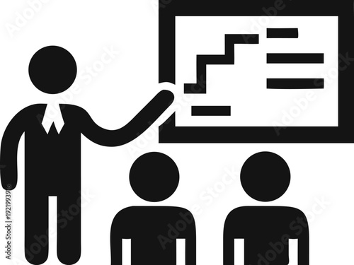 Business professional teaching important concepts and strategies on a visual display board to an audience