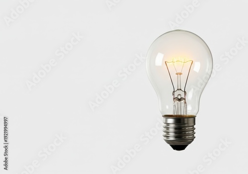 Bright glowing classic incandescent light bulb isolated on a clean white backdrop representing innovation, inspiration, and bright thinking, isolated, solution, glass