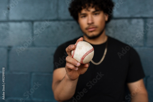 Pitcher holds baseball
