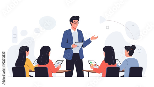 Male teacher presents information to students at desks with tablets