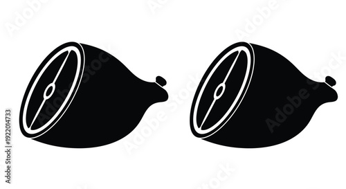 Two halved figs displayed in a stark black silhouette