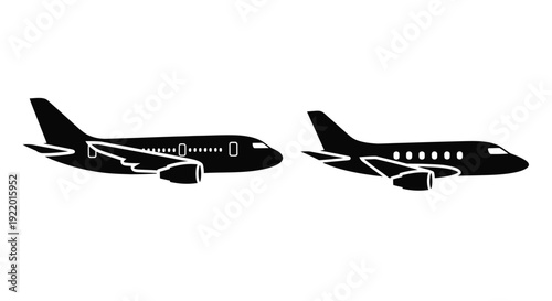 Two commercial airplanes in profile a striking black silhouette