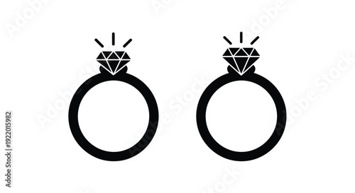 Two diamond rings displayed side by side in a dark silhouette