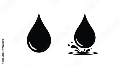 Two black water droplets one impacting a surface a striking silhouette