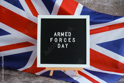 Fotografi ARMED FORCES DAY patriotic scene with signboard and waving flag message UNITED KINGDOM with national colors Festive background with British flag and message board with text Great Britain