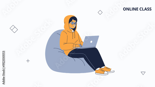Young person in hoodie learning online on laptop while sitting on bean bag chair