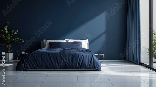 Modern bedroom interior with navy blue bedding and minimalist decor