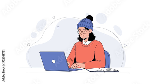 Young woman in warm clothes using laptop, studying or working remotely