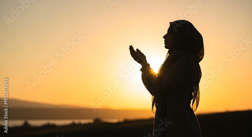 Muslim Woman Making Dua at Sunset During Ramadan