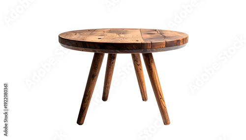 A small, round, wooden table with three legs, set against a stark black background