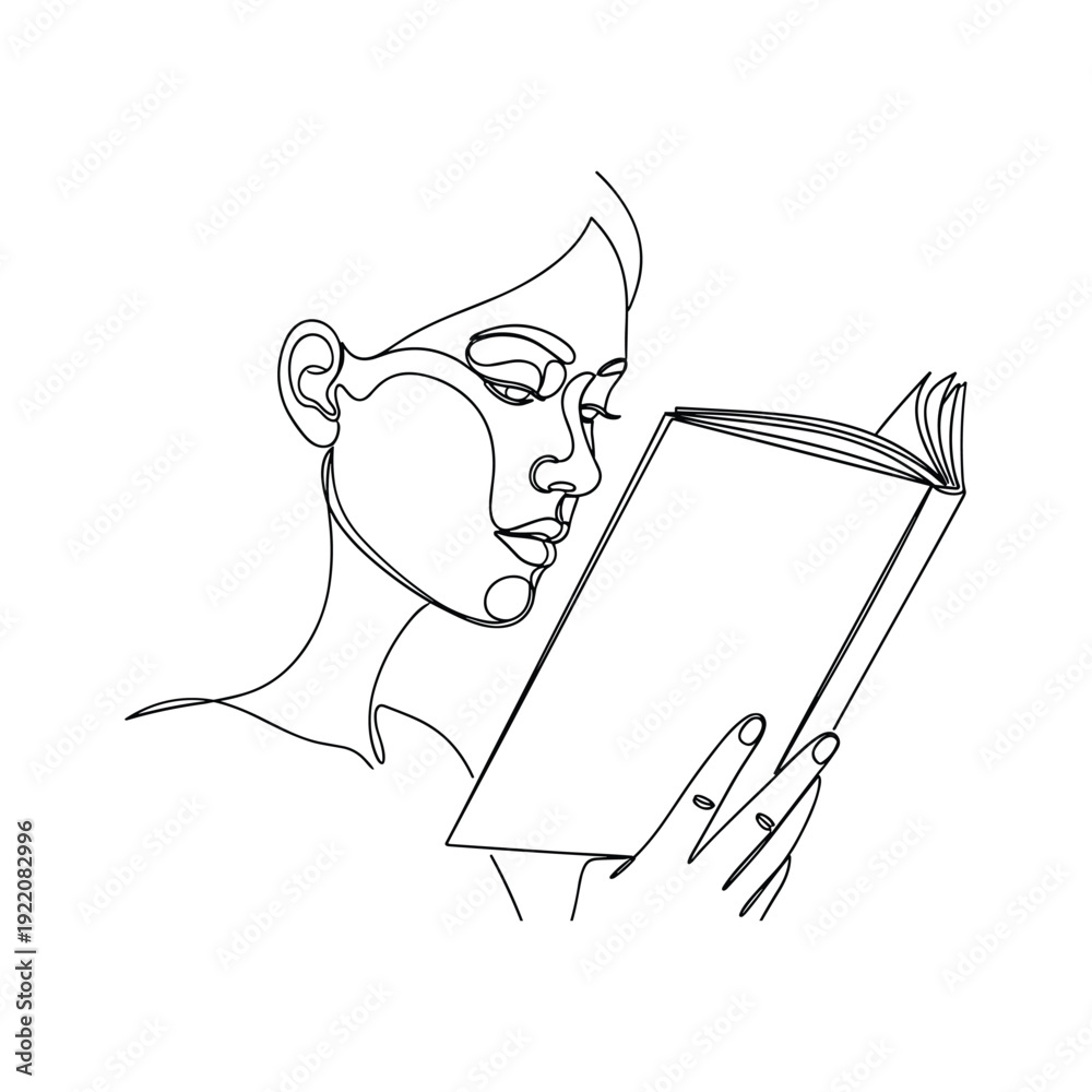 Obraz premium Woman deeply engrossed in reading a book with focused expression