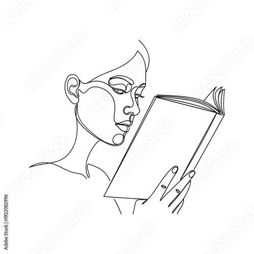 Woman deeply engrossed in reading a book with focused expression