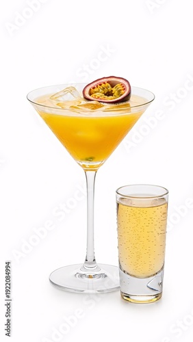 Passion fruit martini garnished with passion fruit and served in a glass