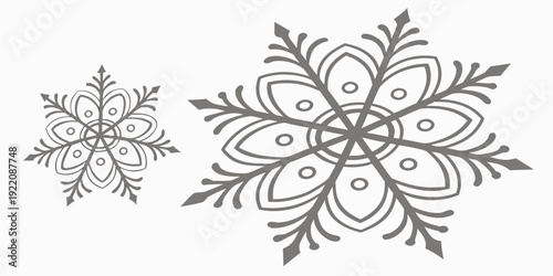 Intricate black and white floral and snowflake designs on a white background
