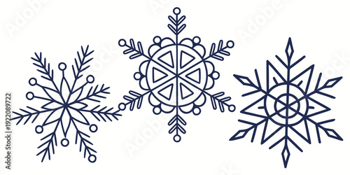 Three intricately designed snowflakes showcasing unique patterns and structures