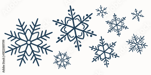 Intricate blue snowflakes displayed on a white background.