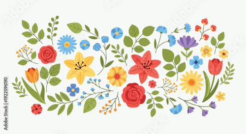 Colorful assortment of varied flowers and green foliage arranged on white