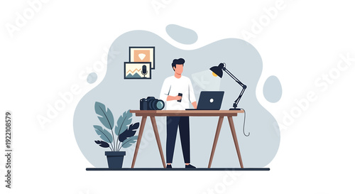 Man working at desk with laptop and camera.