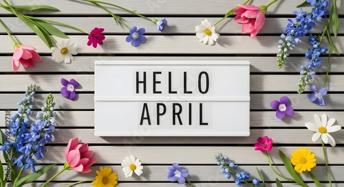 Vibrant floral arrangement welcoming spring with hello april sign