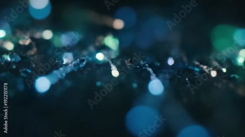 Bioluminescent Trails Underwater shot of microscopic organisms forming ethereal, glowing paths in dark ocean depths.