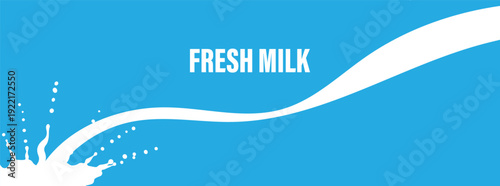 Fresh milk splash on blue background with white liquid stream
