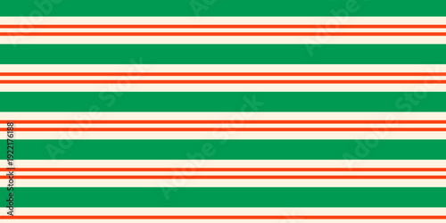 Christmas seamless pattern. Red and green diagonal stripes background. Candy cane repeating decoration wallpaper. Winter holiday lines backdrop. vector