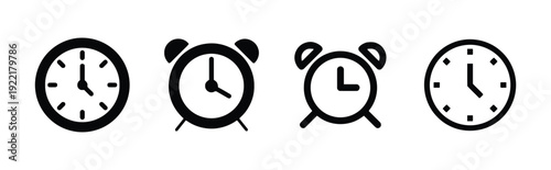 Group of four black clock and alarm clock icons on white background